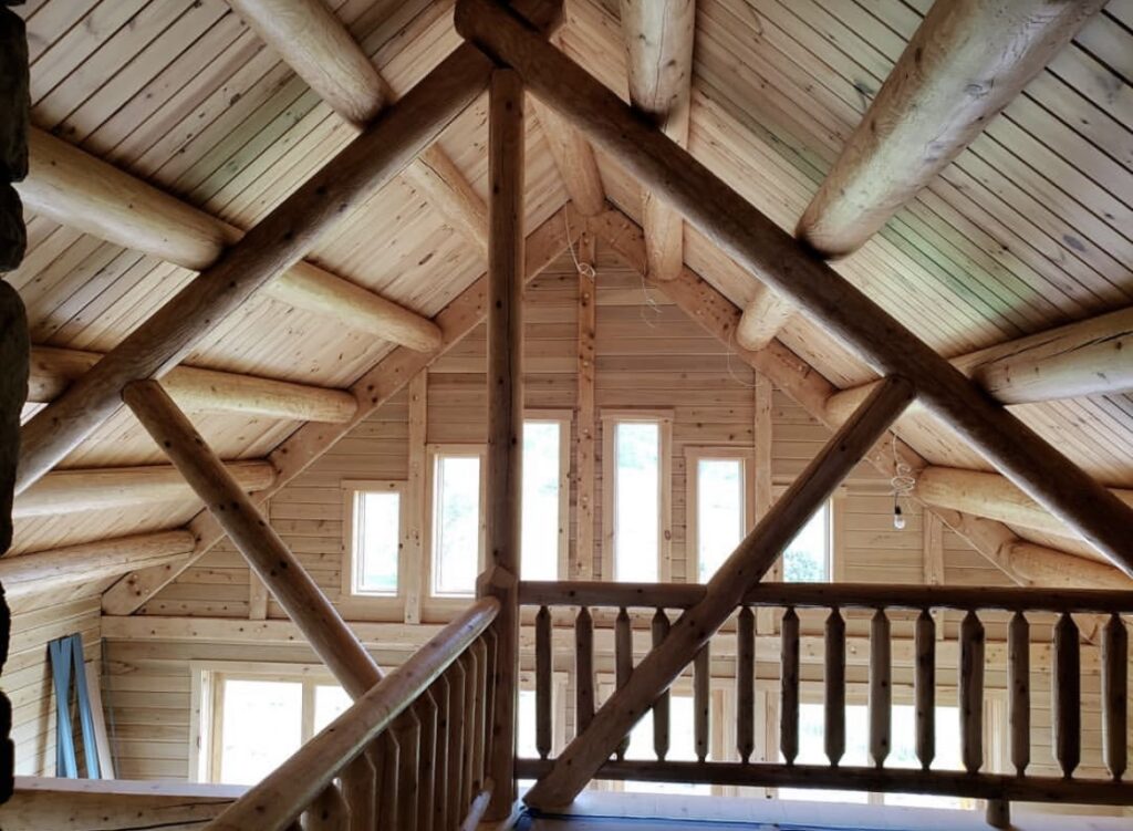 Custom cedar log home with timber framing and mountain views