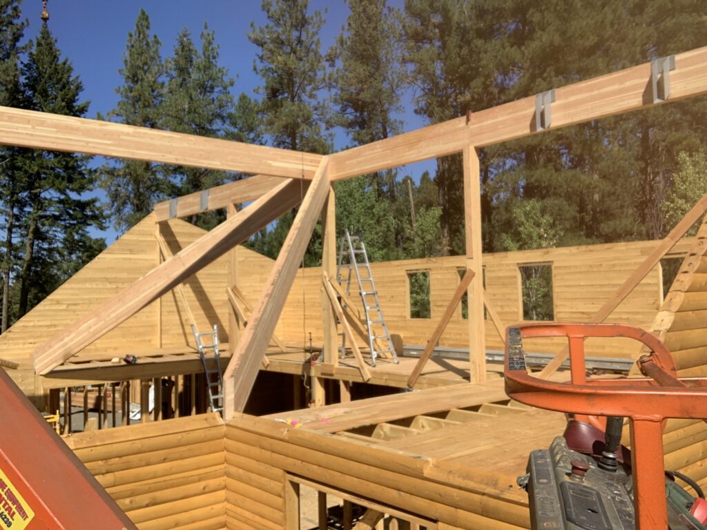 Structural roof framing for cedar log cabin construction