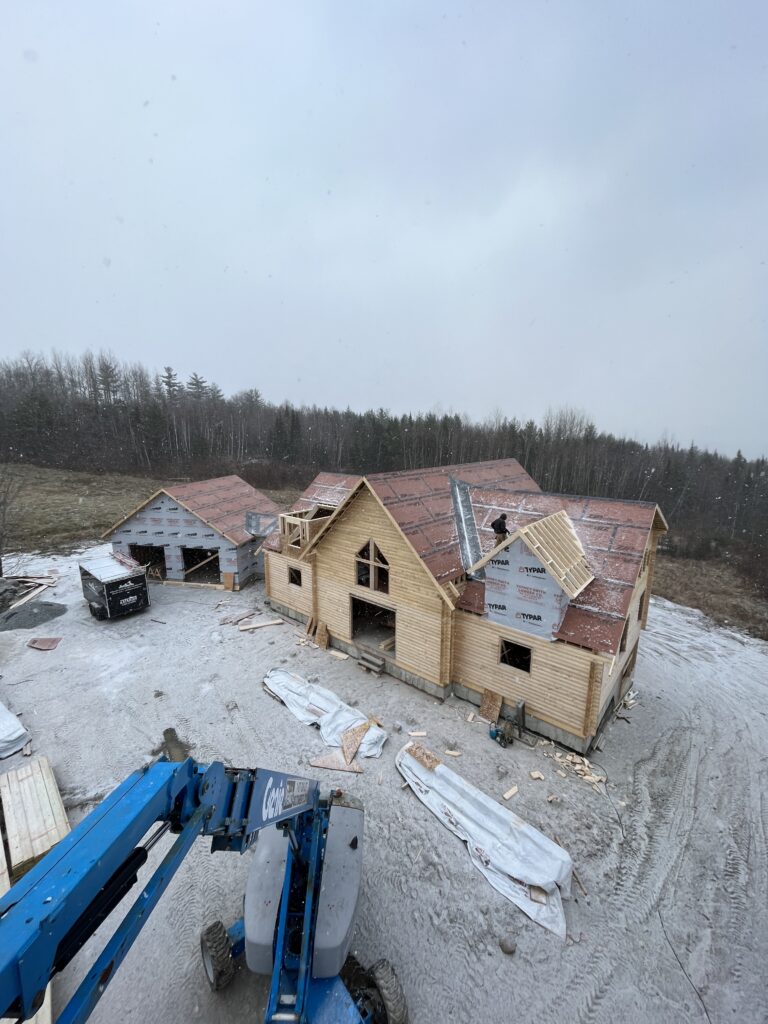 Interior of custom Northern White Cedar log home with timber framing