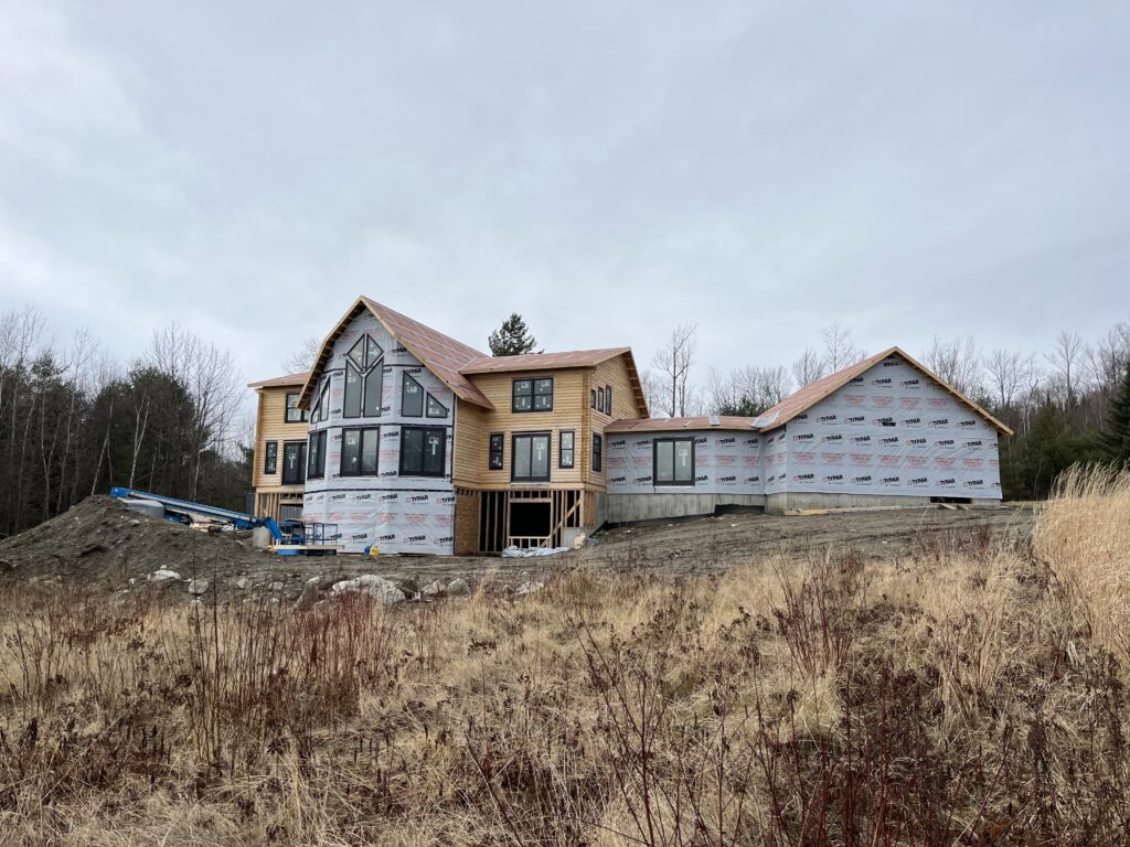 Interior of custom Northern White Cedar log home with timber framing