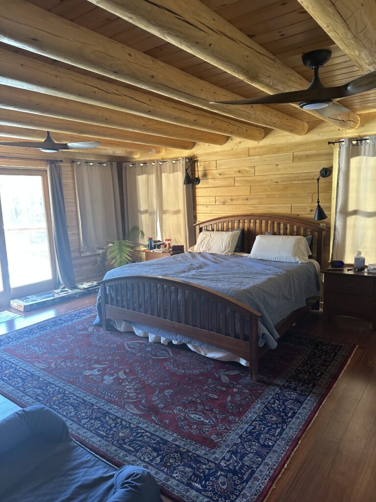 Interior of custom Northern White Cedar log home with timber framing