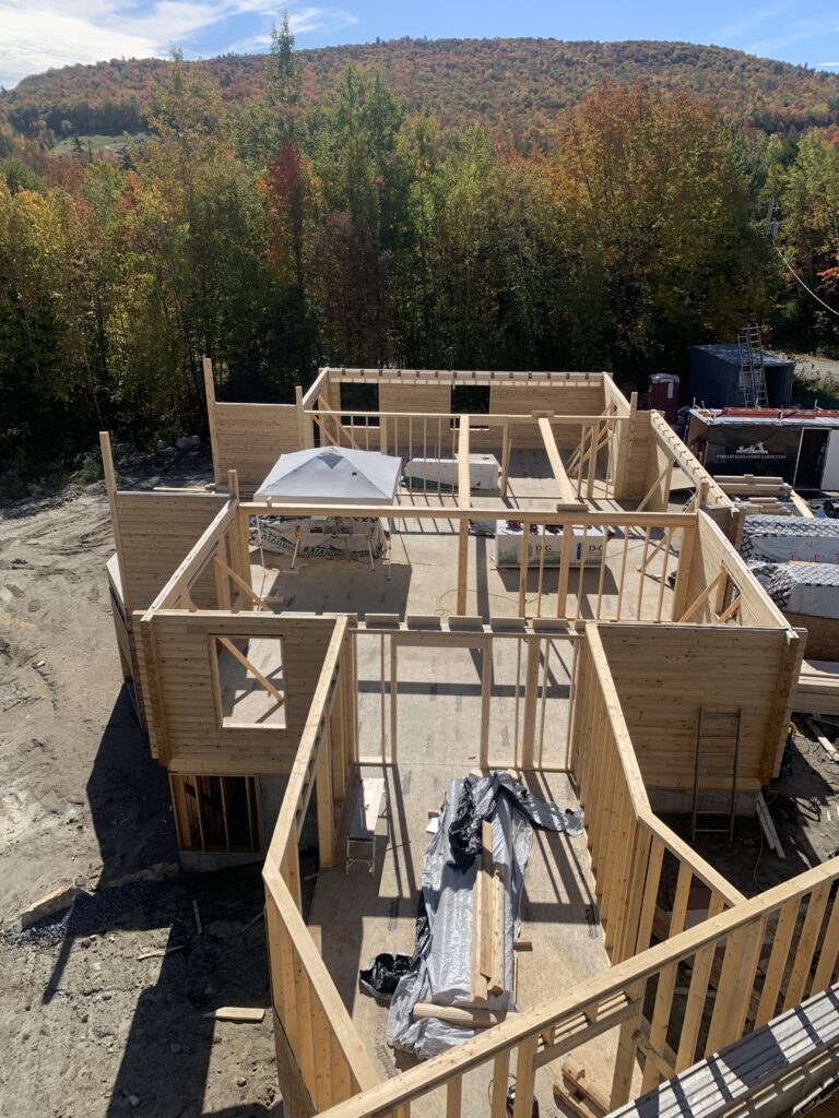Interior of custom Northern White Cedar log home with timber framing