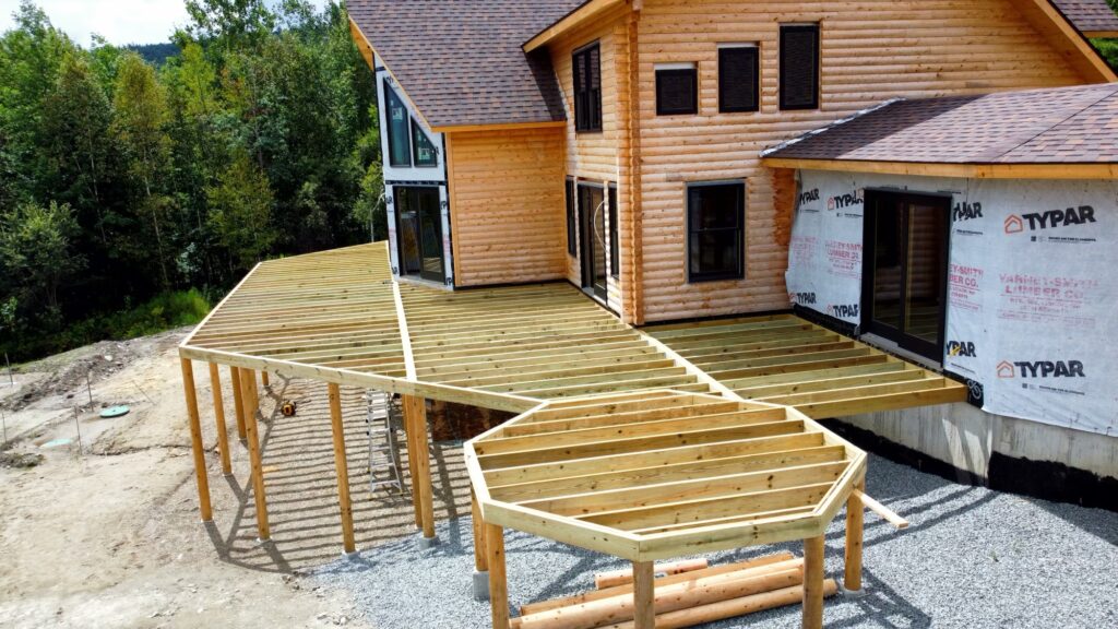 Interior of custom Northern White Cedar log home with timber framing