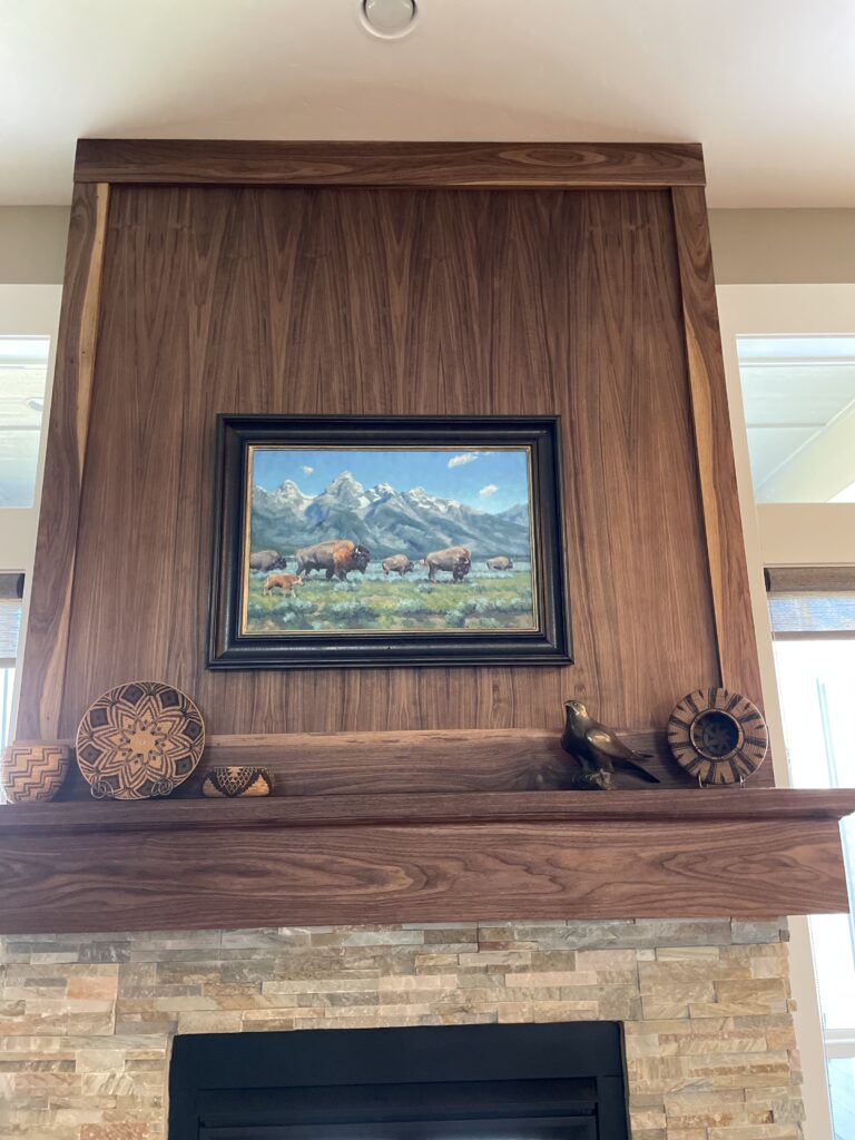 Custom fireplace surround in Boise Idaho with hardwood mantel and detailed finish carpentry